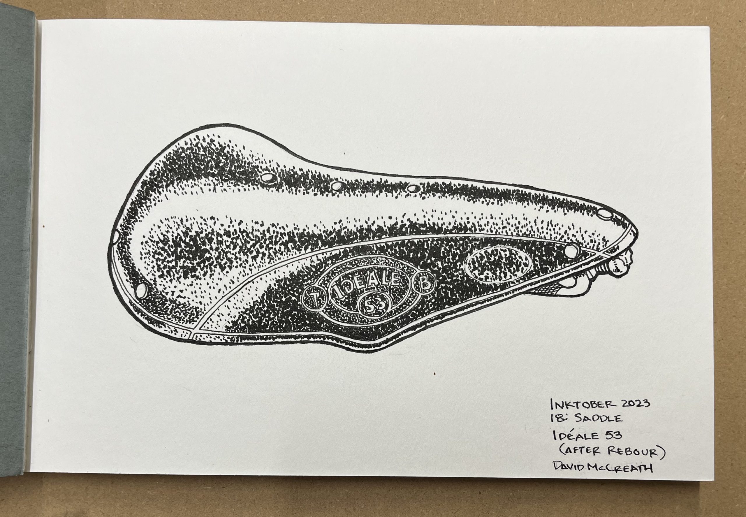 A pen and ink drawing of a leather bicycle saddle in the style of artist Daniel Rebour.